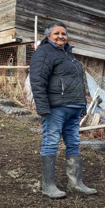 Full length shot of Evelyn sarten in mud boots.